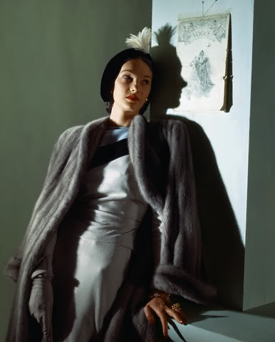 1940s Fashion: 1943 Women's Dress by Clare Potter featuring a fur coat over top and a 1940s hat. 