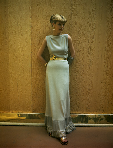 ca. 1946 --- Model wearing sand-colored jersey dinner dress with fluted hemline by Clare Potter. 1940s Fashion.