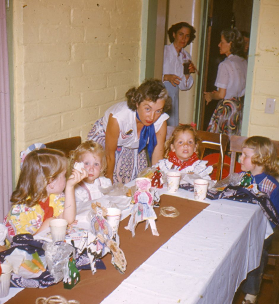 1950s 1960s thanksgiving photo of kids sitting at the kids table