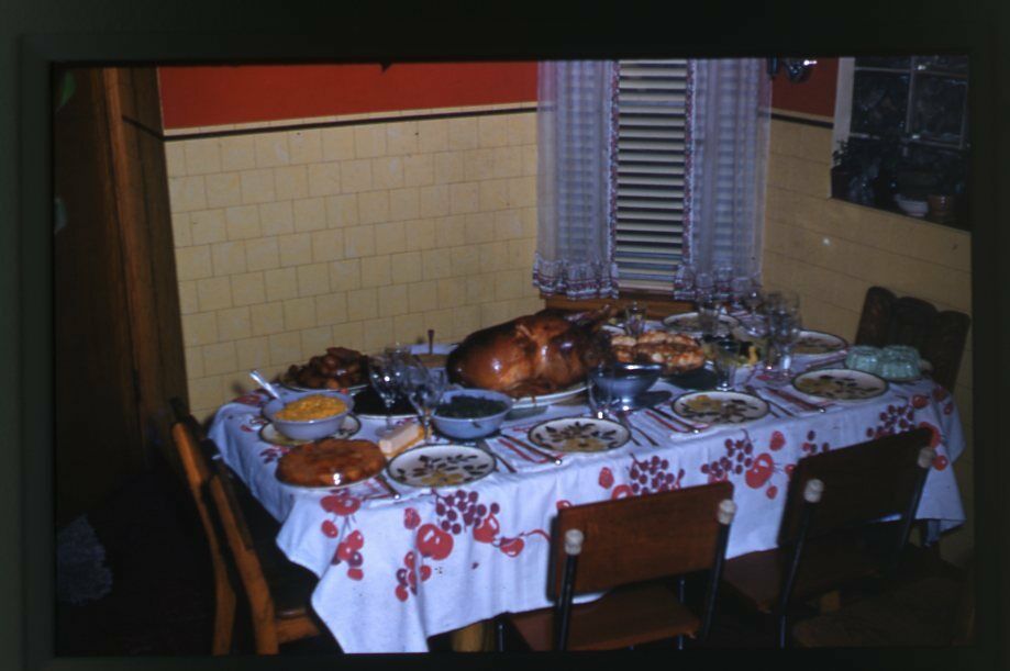 1950s vintage photo of a Thanksgiving Dinner Table filled with Turkey and the trimmings