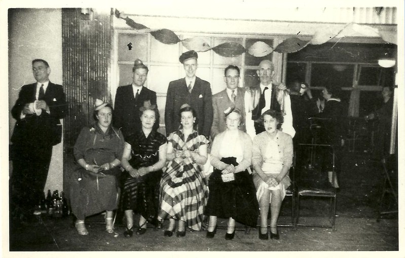 1950s Photo of a 1950s Christmas Party.Everyone is wearing party hats