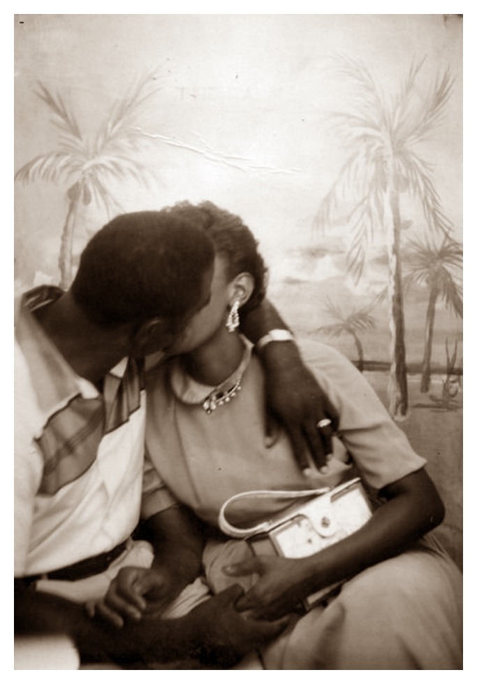 THIS KISS 1950s. An unidentified African American couple sharing an intimate moment. Vintage Black Photo Booth Series. Black History Album