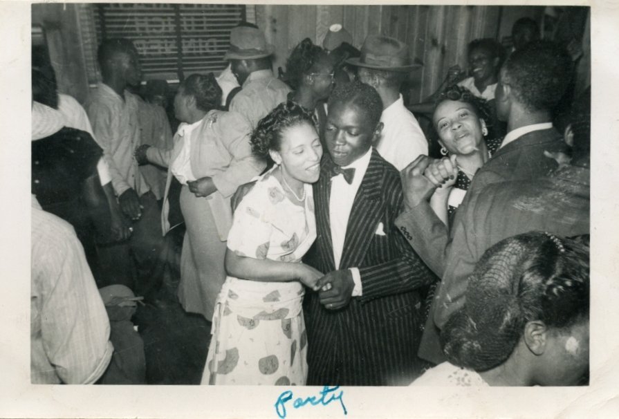 1940s 1950s photo of black people enjoying a house party.  