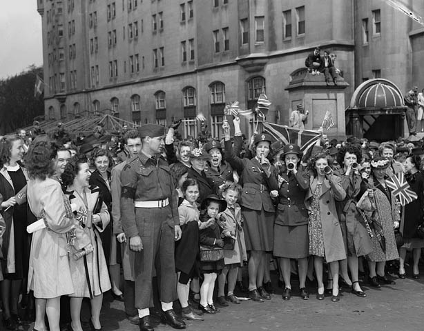 1940s vintage photo of a Crowd at the Victory Loan Indicator, Confederation Square, on VE-Day, Ottawa, Ontario