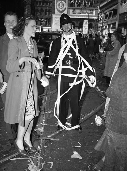 1940s vintage photo of P.C. Harry Carroll at V-E Day celebrations, looking north on Bay Street towards Queen Street
May 8, 1945