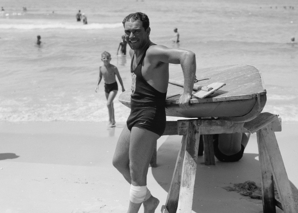 1930s vintage photo: Photograph shows a lifeguard in a one piece men's swimsuit on a Tel Aviv beach in the 1930s. 