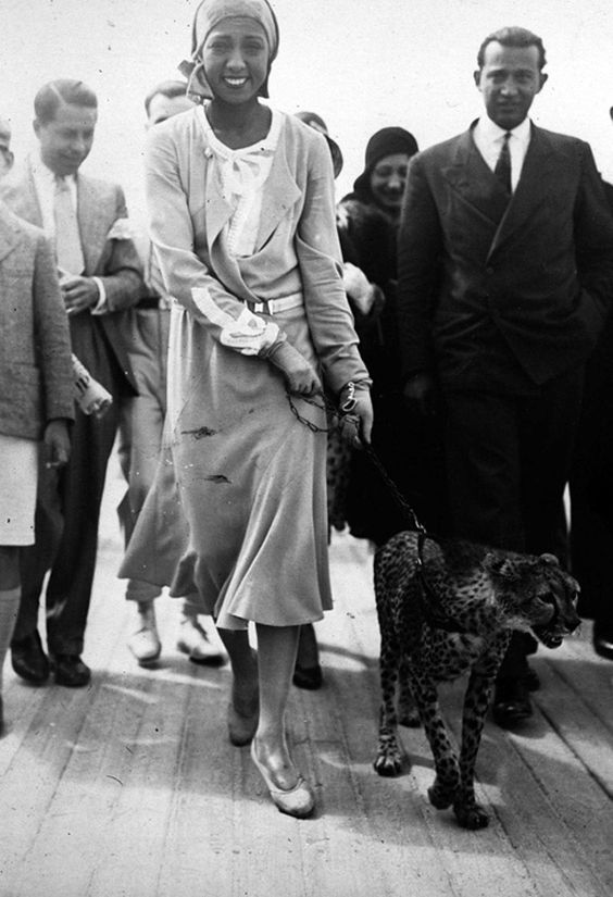 Josephine Baker takes her pet cheetah Chiquita for a walk, 1931 vintage photo