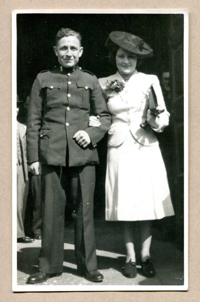 1940s Vintage Weddding Photo of a Soldier and his Bride her wonderful two piece suit wedding outfit. 