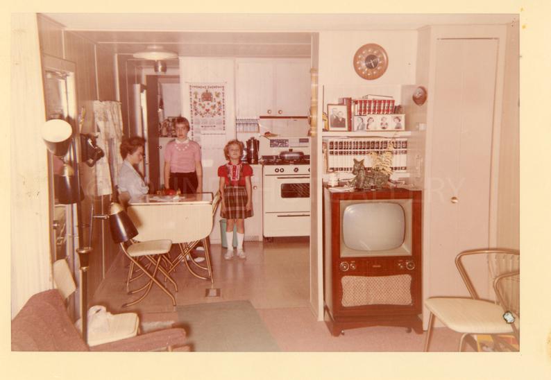 1950s/ Mid Century Modern Vintage Photo of Mom and Daughters Standing in Kitchen, View From Living Room. SO much home decor inspiration in this photo!