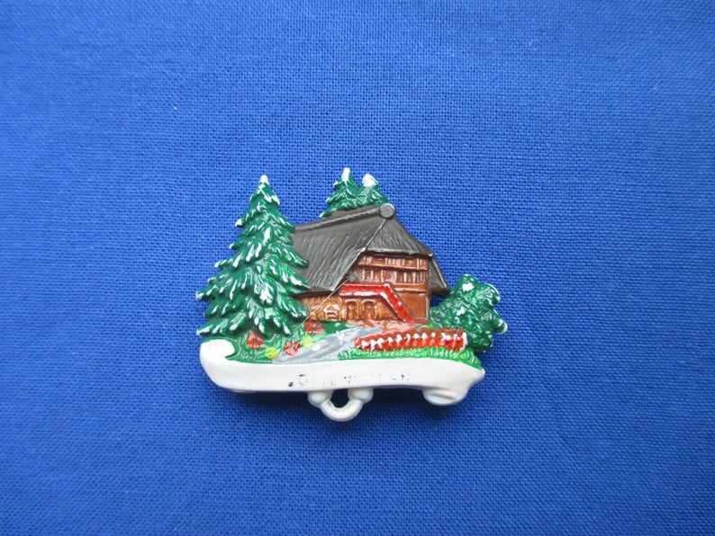 1960s Hat pin featuring the well known Black Forest Home. 