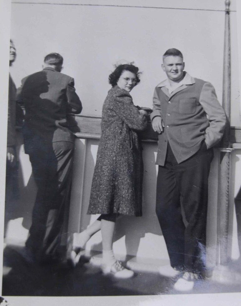 1940s Photo of a couple on a boat in 1940s fashions and saddle shoes