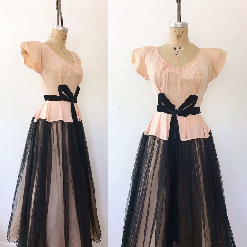 1940s Fashion: Late 40s full length evening gown patterned silk (or blend) voile bodice and skirt
velvet bow waist black netting overlay on the sweeping skirt