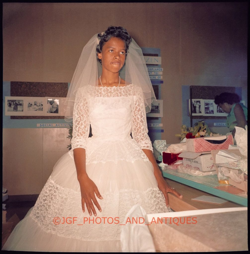 1950s vintage image of a young Black woman in her 1950s wedding dress on her wedding day.