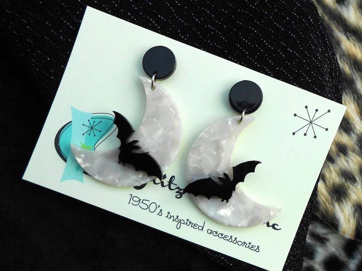 1950s white lucite cresent moon bat earrings glitzomatic halloween