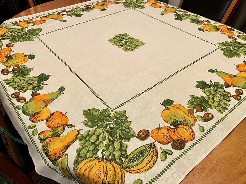 Vintage Thanksgiving Decoration: 1960s fall / Thanksgiving tablecloth with all the fruits of a bountiful autumn harvest printed around the border 