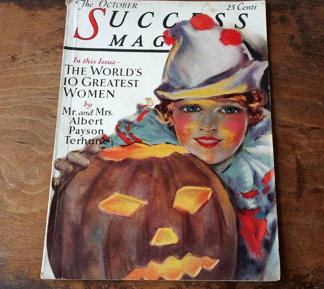 1920s vintage magazine cover: Success Magazine, October 1927 issue, featuring an adorable child dressed for Halloween and a carved Jack 'o lantern.