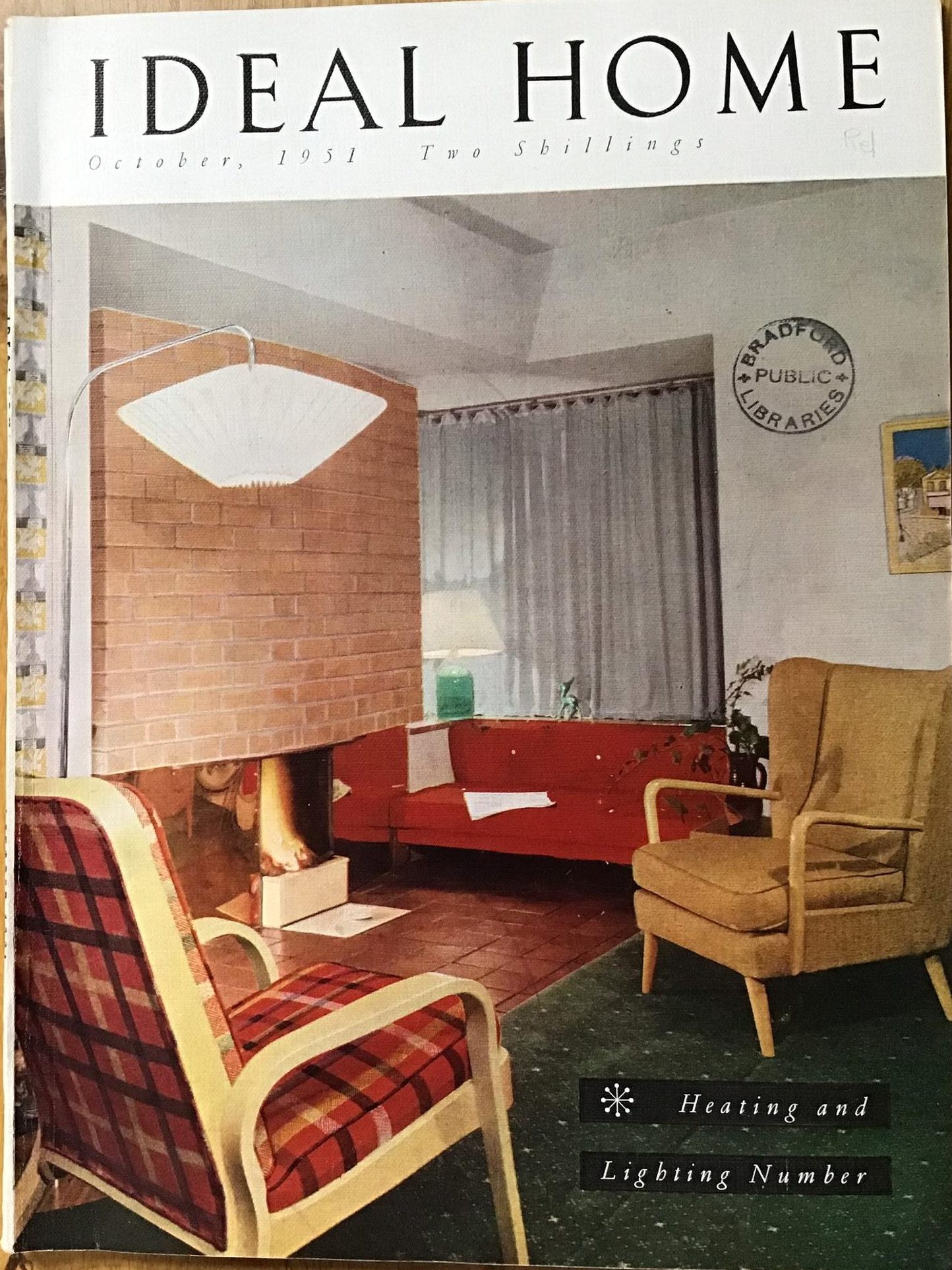 1950s vintage magazine cover: Ideal Home Magazine. October 1951 - Home, Garden and Vintage Advertisements. The cover features a 1950s livingroom with fireplace. 