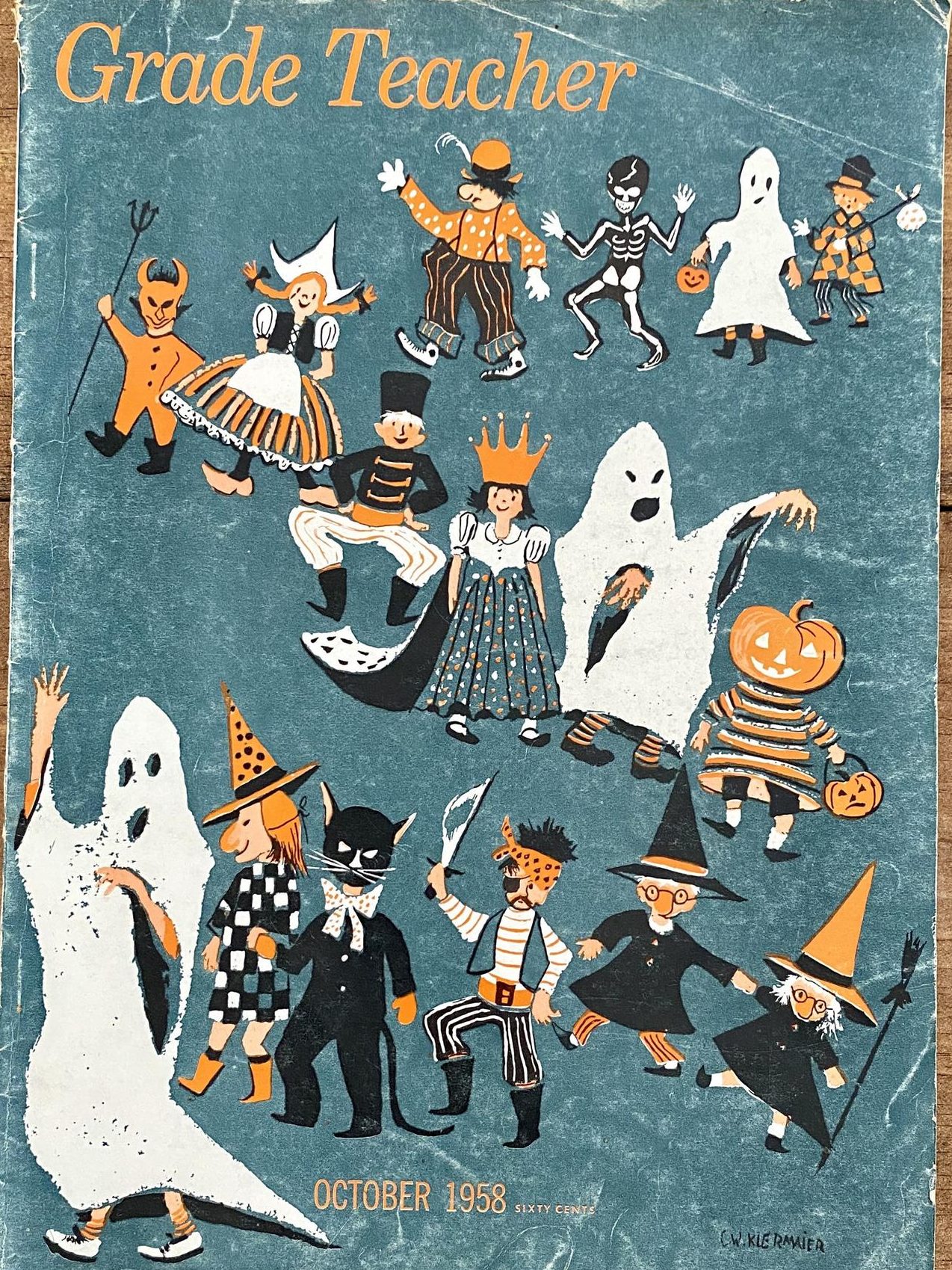 1950s vintage magazine: 1958 Grade Teacher magazine featuring fall crafts and Halloween songs. The cover has kids in halloween costumes.