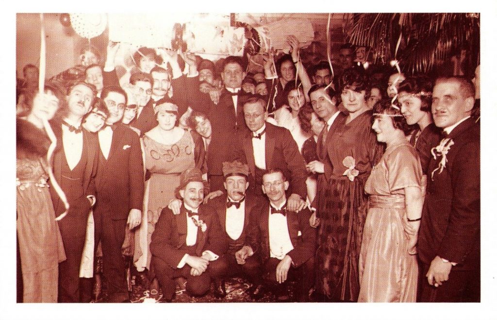 1920s New Years Eve party group photo. 1920s Fashions on display in this vintage photo