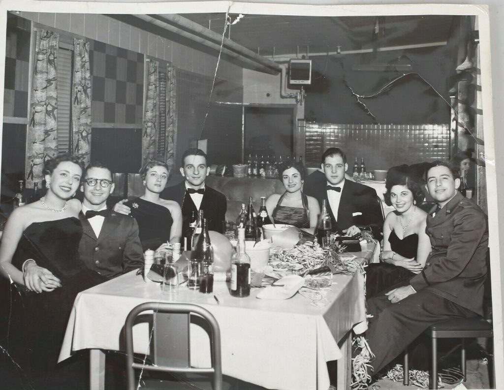 1953 New Year's Eve Party Group Drinking and having fun in 1950s fashions. 