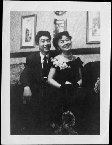 1940s Vintage photo: Raymond Moriyama and his sister Joan at a friend's house on New Year's Eve, 1949. Japanese family 1940s. 