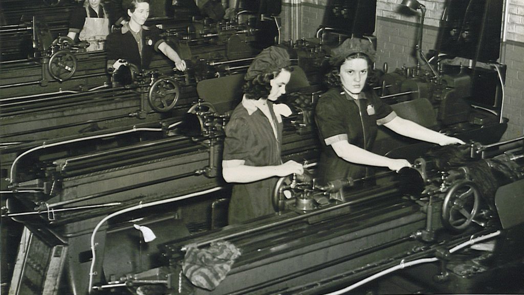 Vintage Photo: 1940s Photo of women working on the homefront in a factory in mississauga at the small arms building making small guns. 