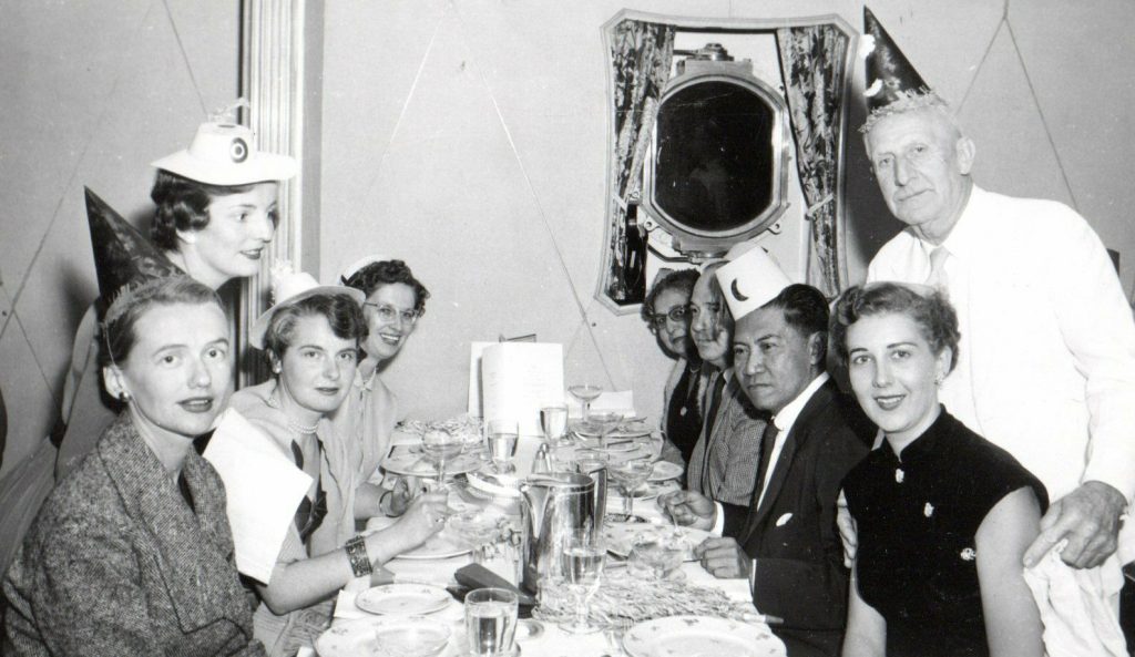 Vintage 1950s image of world traveling party goers On board the S.S. "Maasdam". Holland America Line.