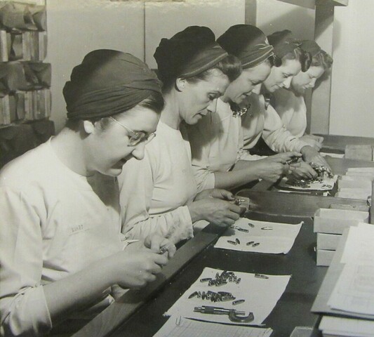 1940s Vintage photo of Bomb Girls in ontario Canada. Performing an ammunition quality inspection, GECO munitions factory, Scarborough, c. 1943. Courtesy of the Hamilton Family.