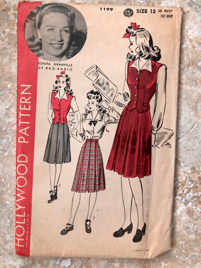 1940s vintage sewing pattern for a women's waistcoat, skirt, and blouse. This is Hollywood 1199 and the pattern is date stamped 1943