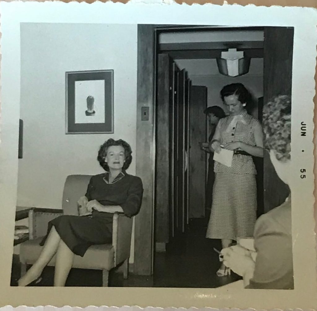 1950s vintage photo: June 1955 Vintage Photo of women picking up their pay check at their office. 