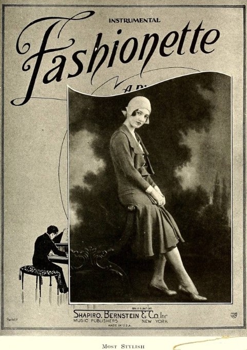 Most Fashionable as seen in a 1930s yearbook. The young woman is wearing late 1920s fashions. 