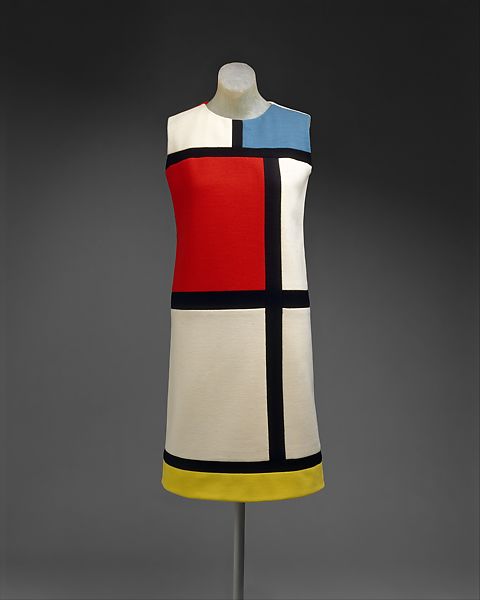 As the sack dress evolved in the 1960s into a modified form, the shift, Saint Laurent realized that the dress's planarity was an ideal field for color blocks. Knowing the flat planes of the 1960s canvases acheived by contemporary artists in the lineage of Mondrian, Saint Laurent made the historical case for the artistic sensibility of his time. Y