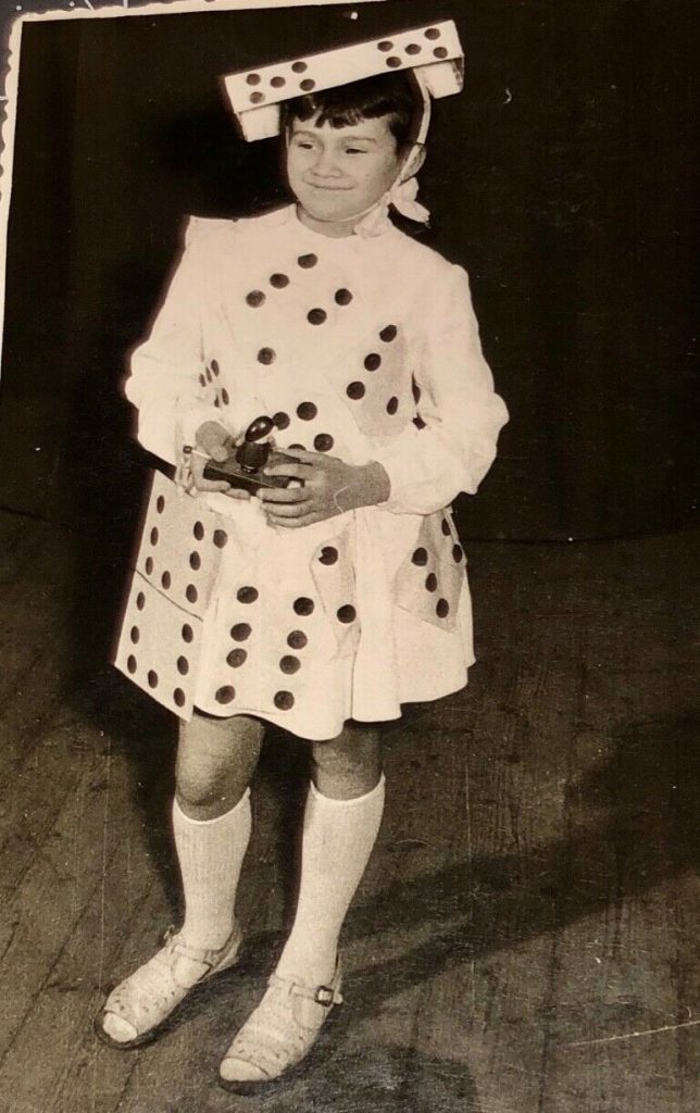 1960s Vintage Photo of a young girl in her Halloween Costume as a Domino. Fun Vintage Halloween Photo. 