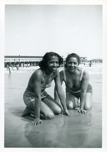 1940s or 1950s vintage photo of two Black women in swimsuits on the beach