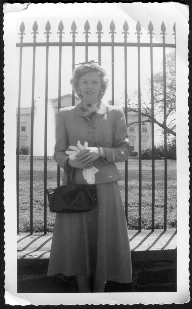 Vintage Photo Woman Posing in Front of White House in Washington D.C. 1950's. She is wearing a 1950s Skirt and Blazer. Cute 1950s fashion