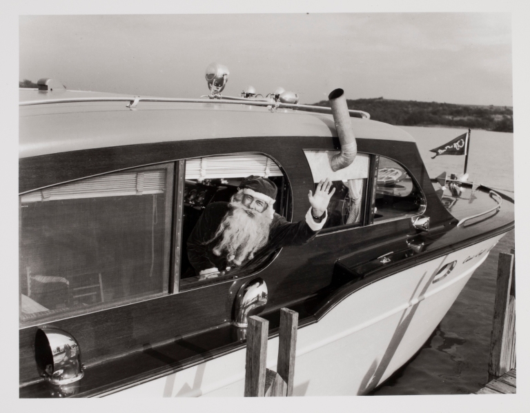 1950s vintage photo of santa on a boat. 