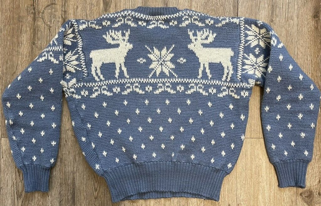 1940s Fashion: 1940s Jantzen Wool knit sweater with reindeers and snow. 