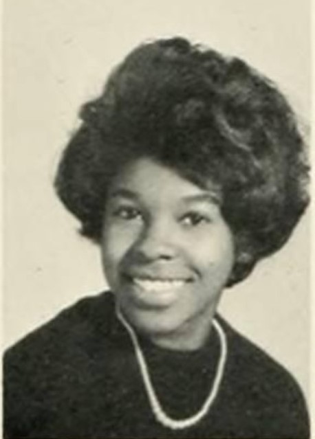 1960s vintage yearbook photo of a young Black woman freshman in college