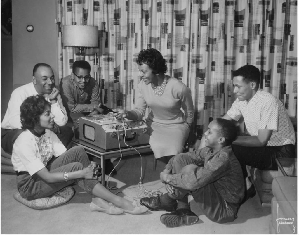 1950s  1960s photo of Canadian Jazz Singer Eleanor Collins with her family in her Mid Century Living Room.