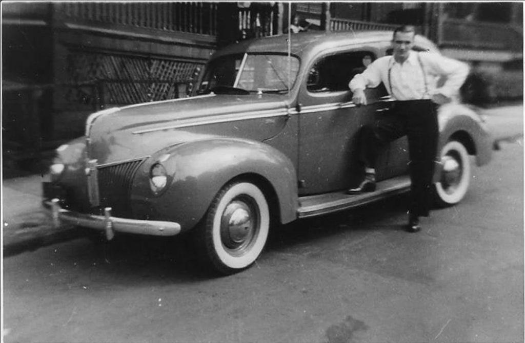 1920s 1930s vintage photo of a man posing with his car