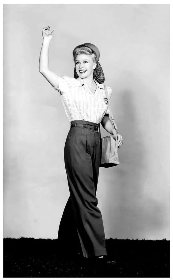 Ginger Rogers, 1940s. Long hair in a snood in this 1940s vintage photo during WW2. Ginger is also wearing 1940s pants.