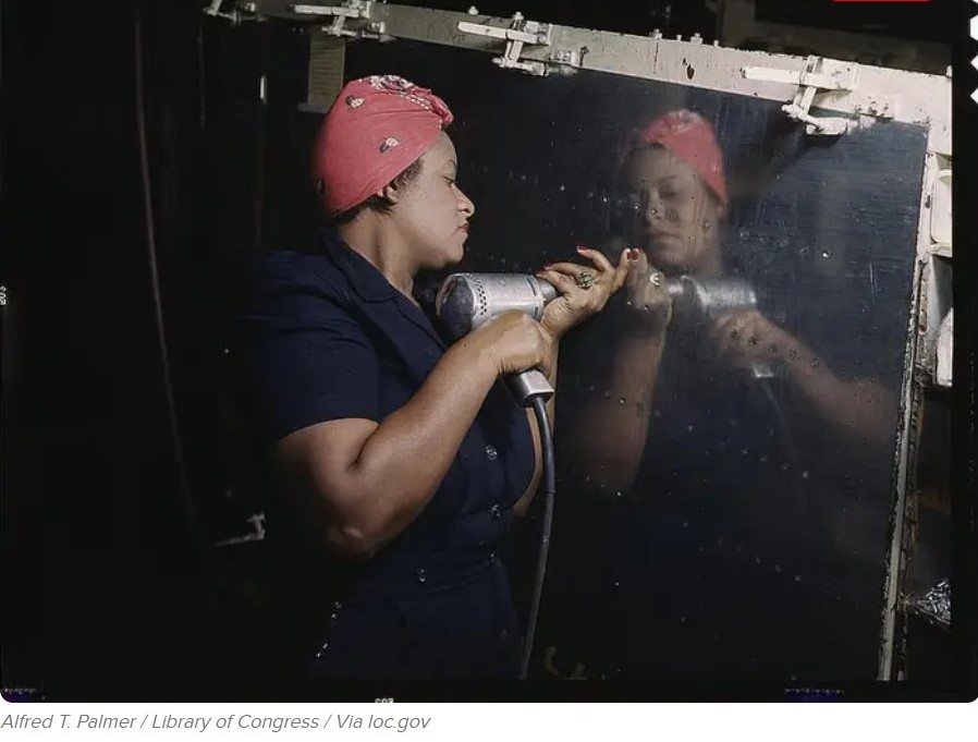 1940s Vintage Photo from WW2 of A woman working on a dive bomber in Tennessee, 1943.