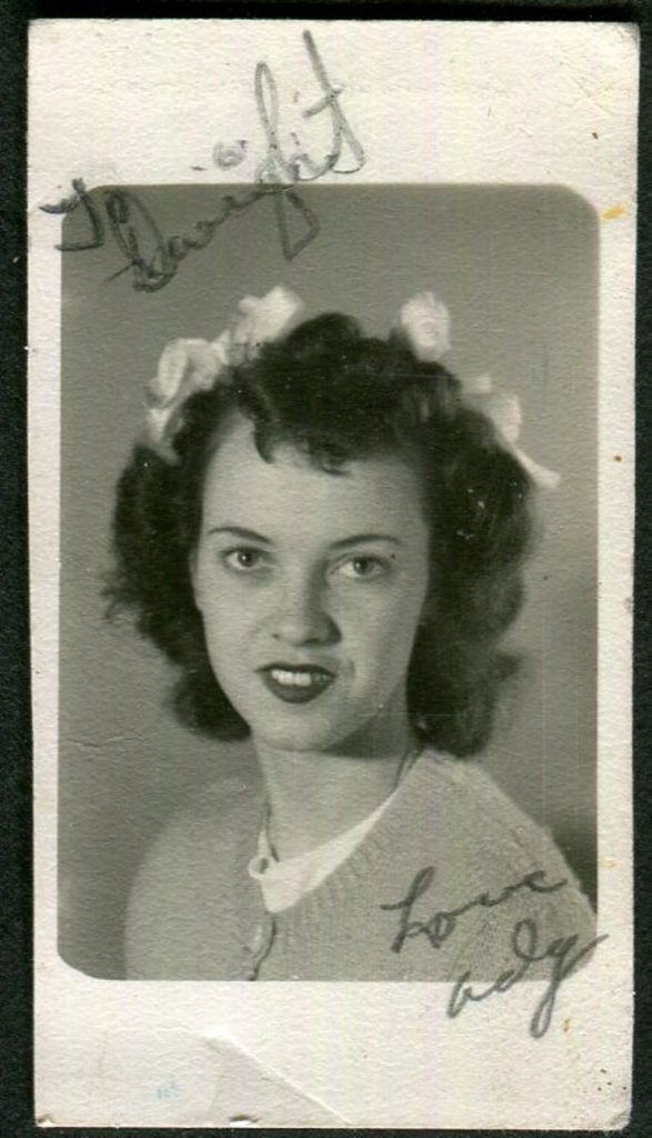 1940s vintage image of a young woman with ribbons in her hair. Cute 1940s hairstyle