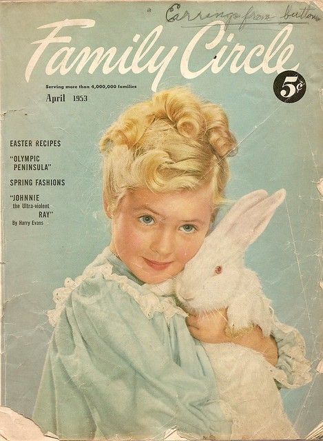 1950s Vintage Magazine Cover for Family Circle Magazine-April 1953. The Cover features a young girl with curly hair holding a bunny. Magazine features Easter Recipes and spring fashions. 