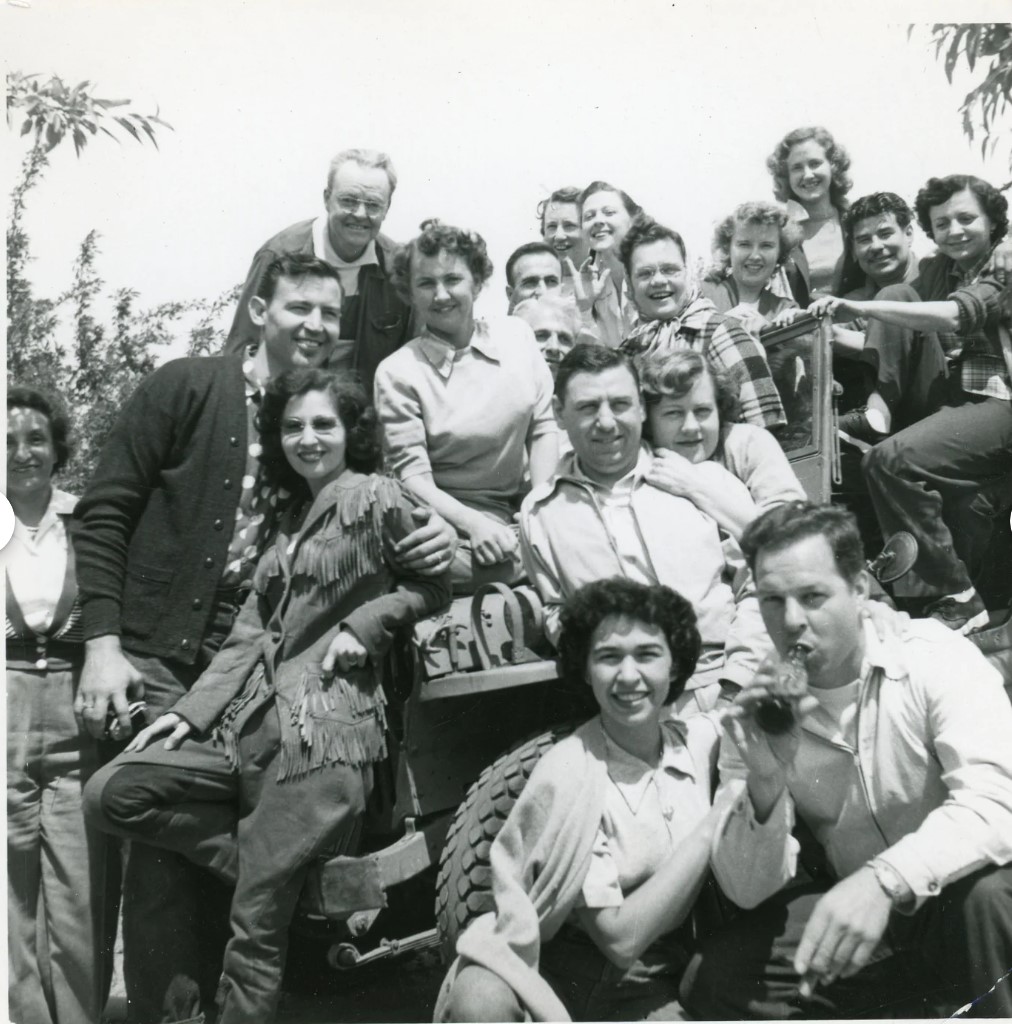 1950s vintage photo: Squeeze In ~ 1950s Vintage Snapshot ~ Group of Men and Women Sitting on a Car in 1950s fashions and 1950s hairstyles. Fantastic Photo! 