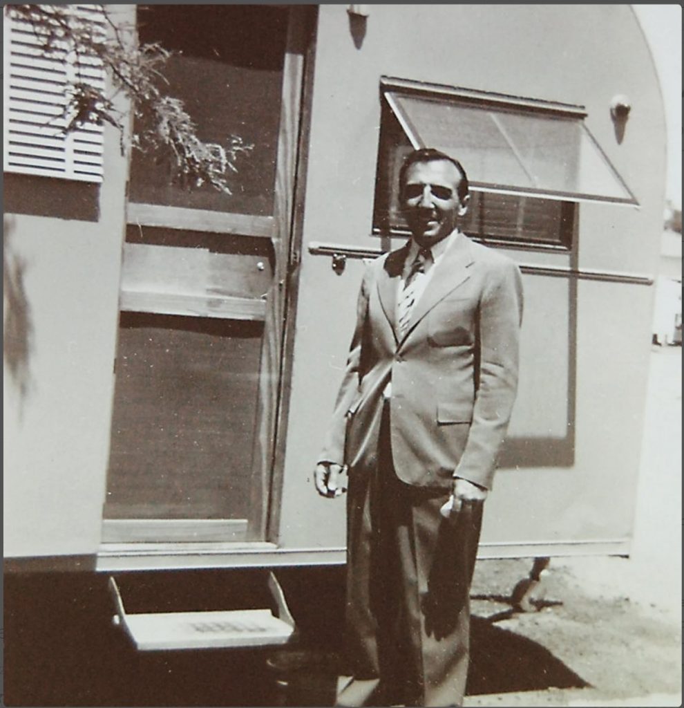 Here is a fun photo of man posing with his camper maybe in the 1940s. 