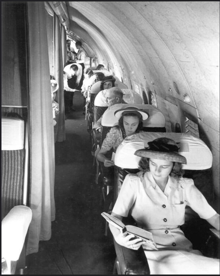 1946 photo of Passengers on a Pan Am Boeing 307 in 1940s fashions. 