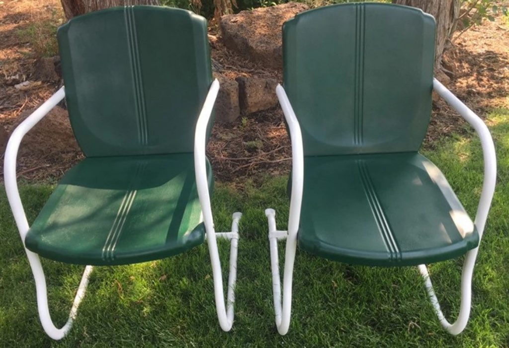 1950s metal patio bouncy chairs in a dark green