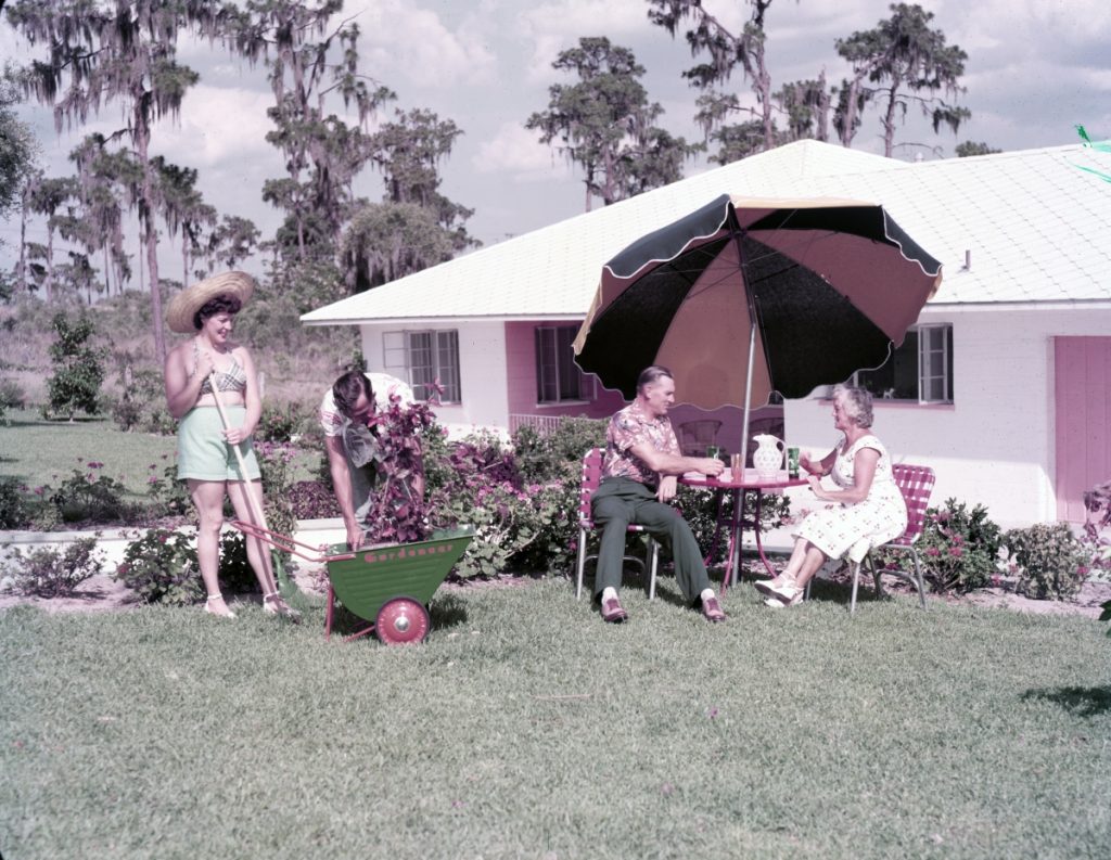 1950s vintage photo of an Advertisement shot for homes in Winter Haven June 1952 featuring 1950s patio furniture 1950s home and 1950s fashions