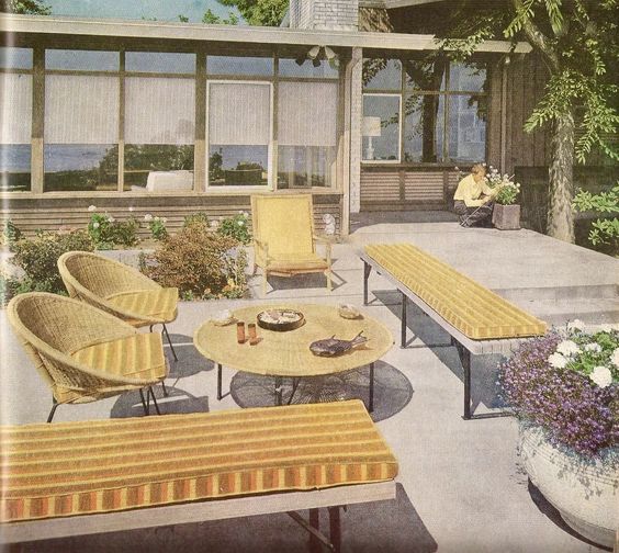 1960s mid century backyard patio image featuring 1960s patio furniture like a rattan basket chair